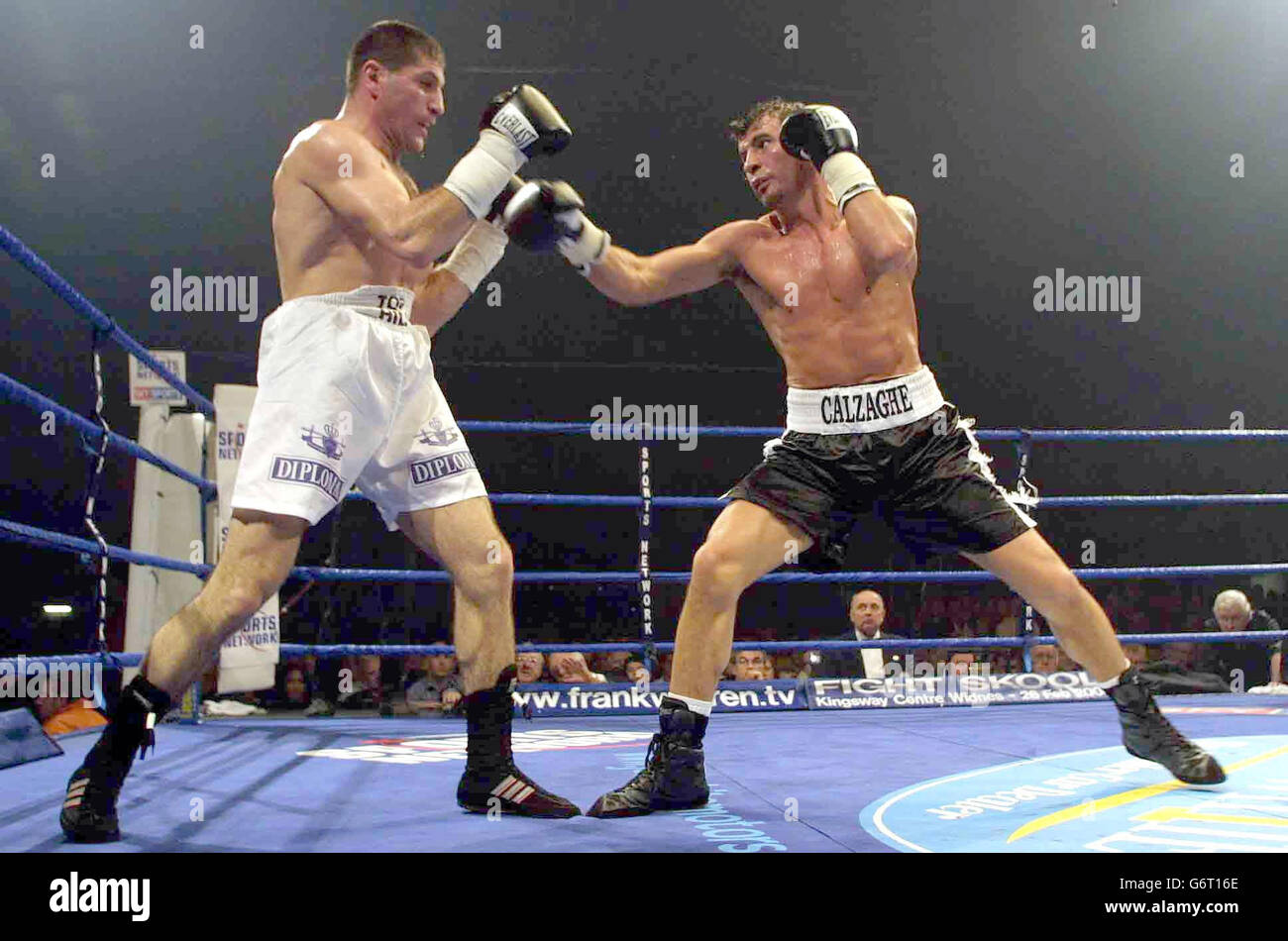 Joe Calzaghe of Wales (right) trades blows with challenger Mger Mkrtchian, during their WBO World Super-Middleweight Championship contest at the Ice Rink in Cardiff. Stock Photo
