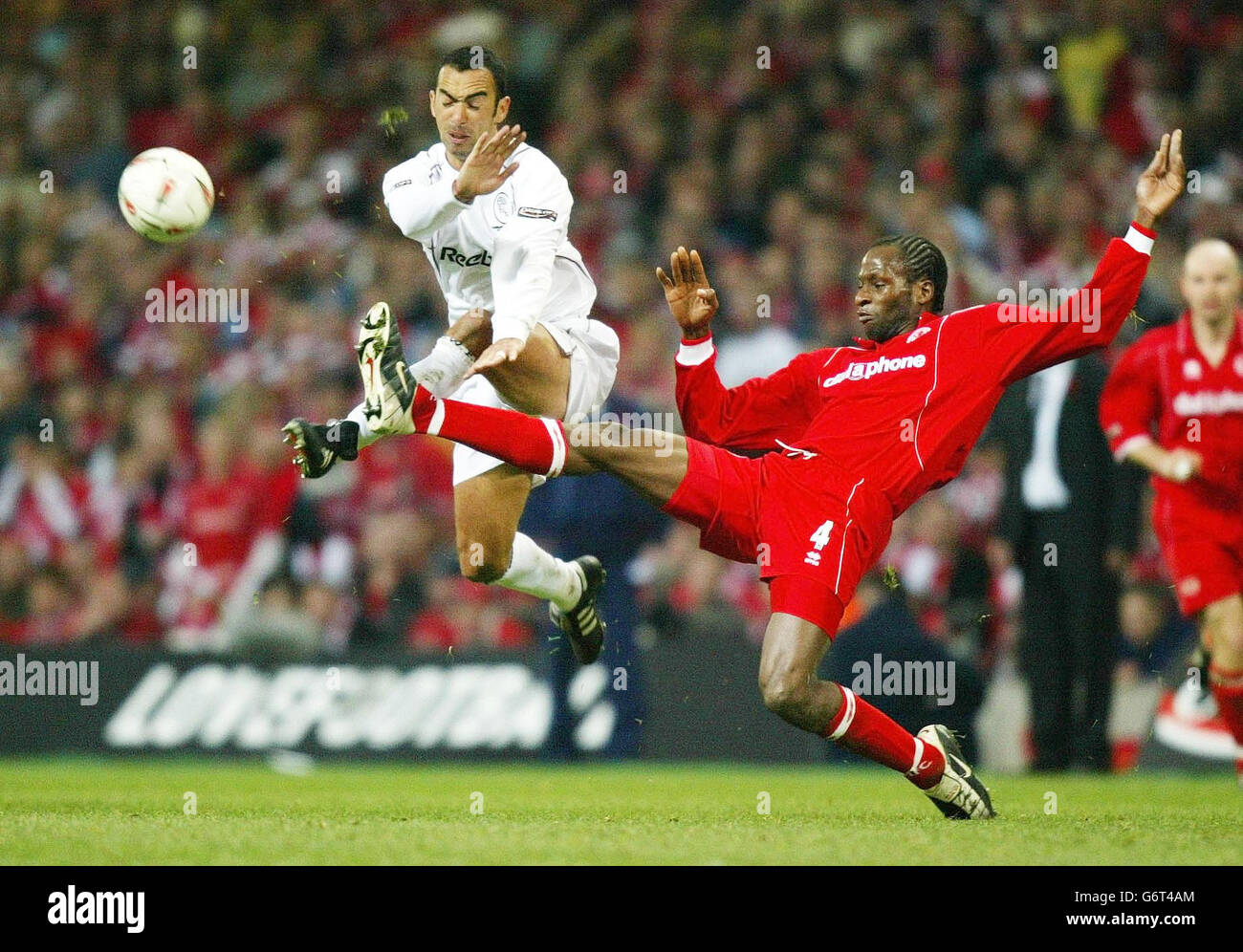 Bolton's Youri Djorkaeff is challenged by Ugo Ehiogu, during the Carling Cup final at the Millennium Stadium, Cardiff. Stock Photo