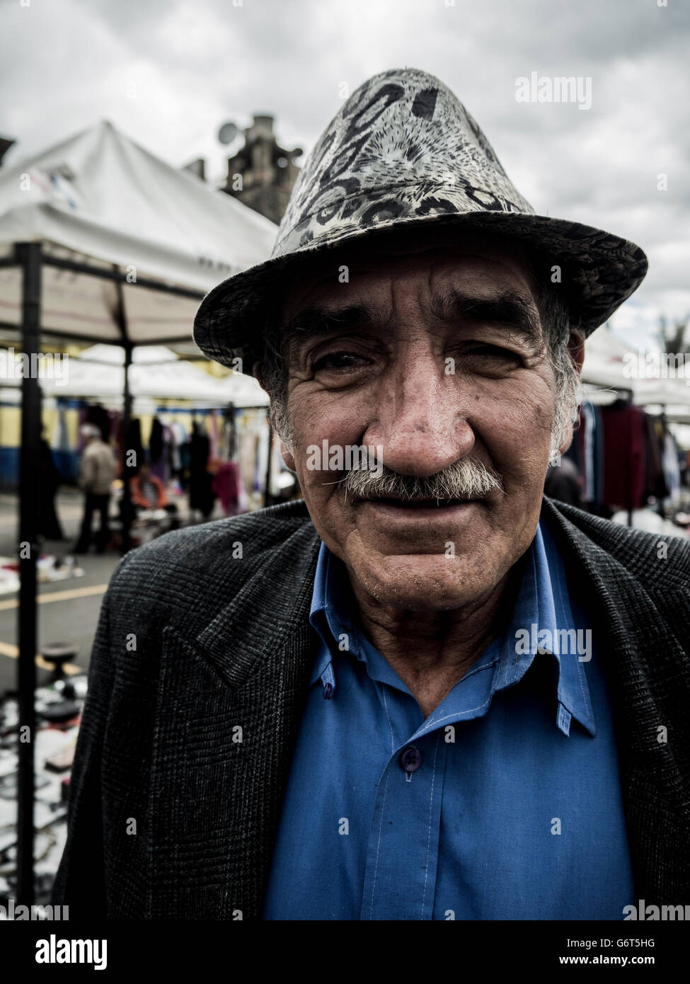 Man wearing leopard print hat Stock Photo