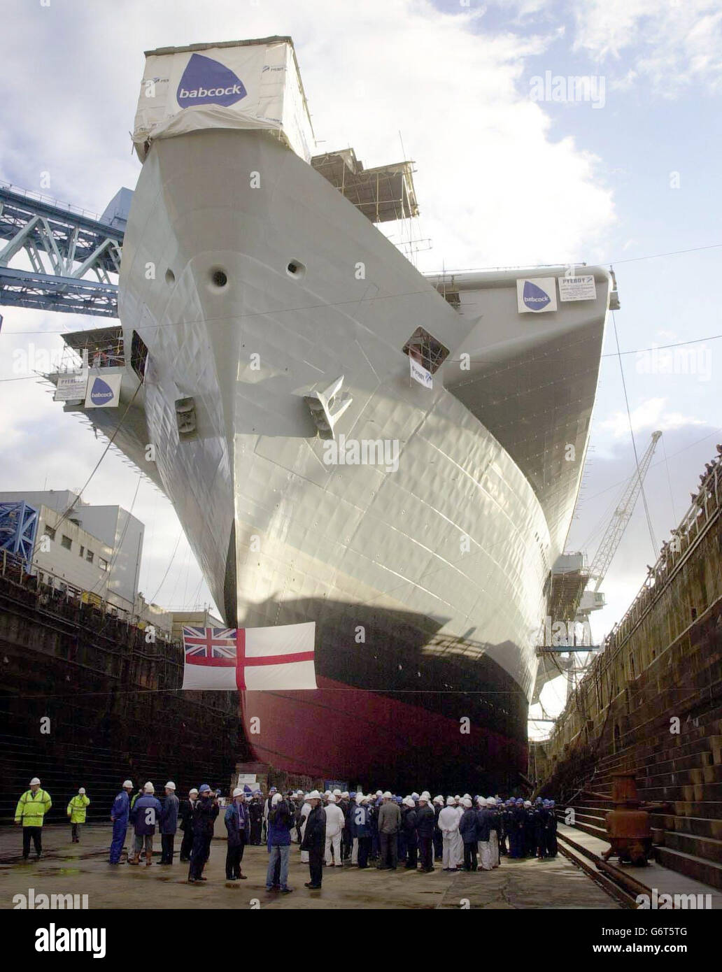Royal Navy Aircraft Carrier HMS Illustrious finishes its refit at Rosyth Dockyard. Her docking marks the half way stage in the ships multi-million pound refit, her first since 1994. She is due to be undocked on Friday in a major step towards her return to full fitness for duty at sea . Stock Photo