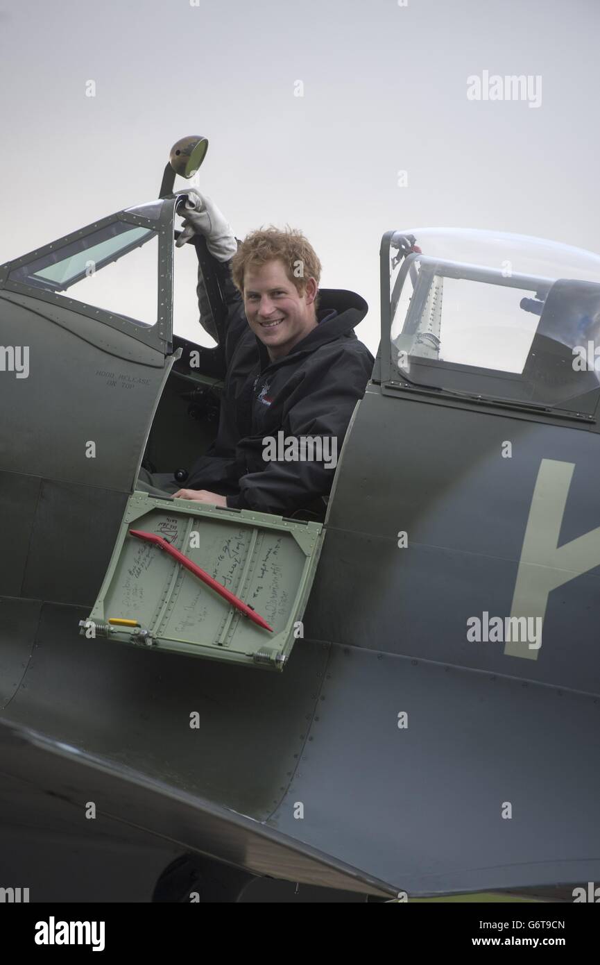 Prince Harry sits in a Spitfire during a visit to the Boultbee Flight