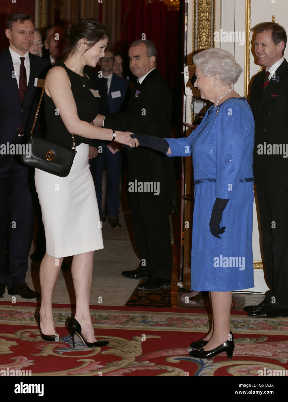 Queen Elizabeth II meets Gemma Arterton during a Reception for the Dramatic Arts, at Buckingham Palace, London. Stock Photo