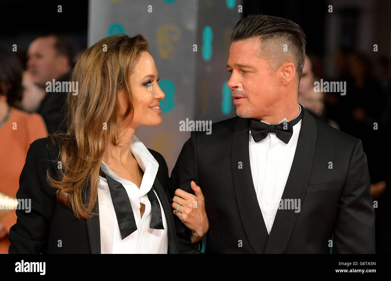 Angelina Jolie and Brad Pitt arriving at The EE British Academy Film Awards 2014, at the Royal Opera House, Bow Street, London. PRESS ASSOCIATION Photo. Picture date: Sunday February 16, 2014. Photo credit should read: Dominic Lipinski/PA Wire Stock Photo
