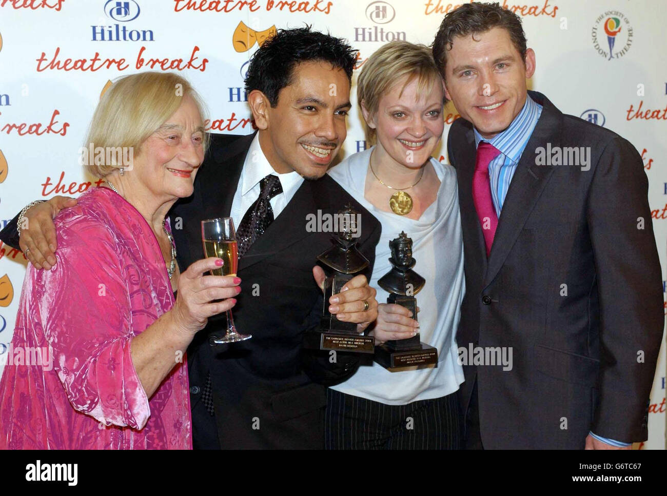(L-R) Actors Liz Smith, David Bedella with his award for Best Actor in a musical, Maria Friedman with her award for Best Actress in a musical and Lee Evans at the Laurence Olivier Awards held at the London Hilton, Park Lane, central London. Stock Photo