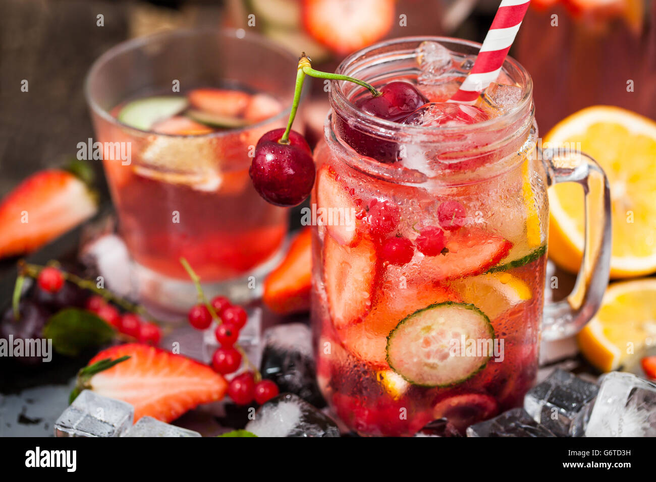 Healthy infused detox water with fresh berries and fruits in mason jar