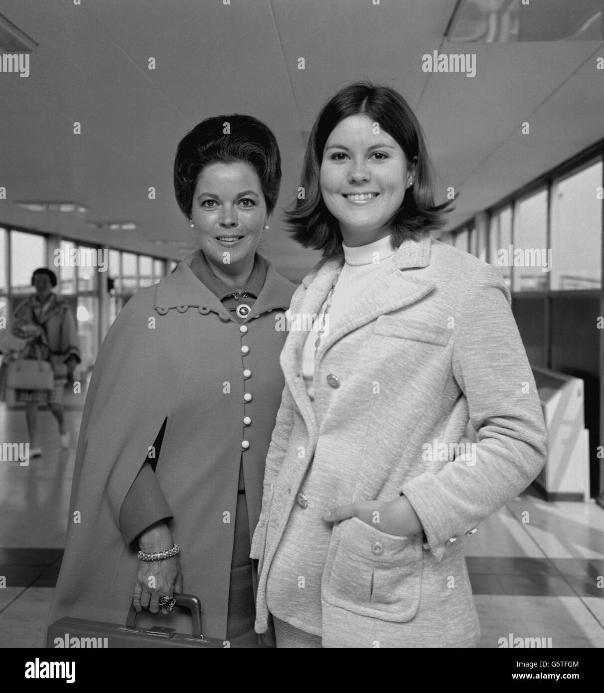 Shirley Temple (Mrs Black), child screen star from the 1930s and wife of electronics engineer Charles Black, on arrival at Heathrow Airport in London from Los Angeles with her daughter Susan. Stock Photo