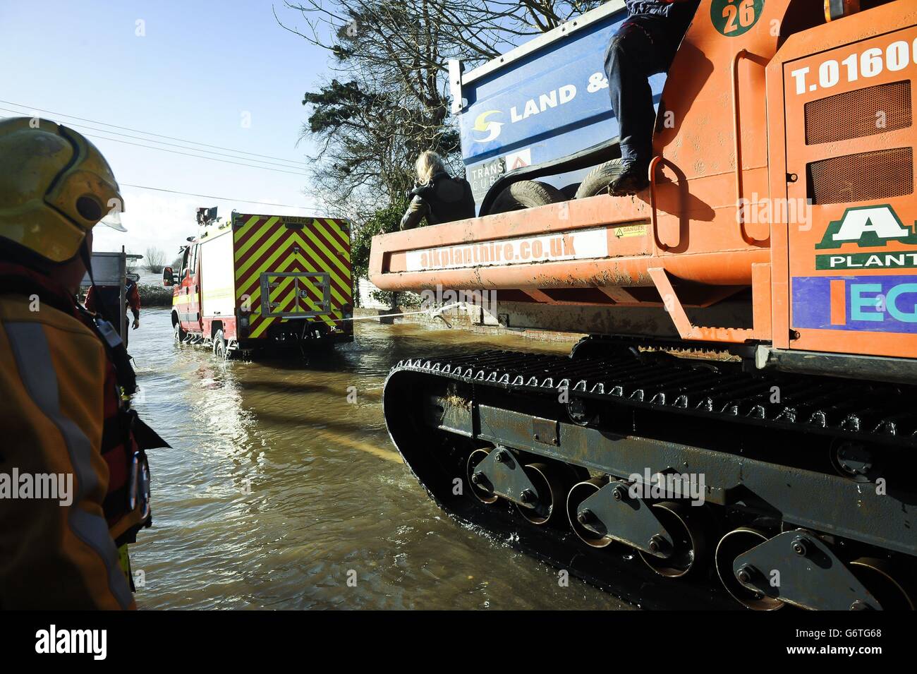 A Devon and Somerset Fire and Rescue service special vehicle is towed after it gets stuck while driving through flooding in Burrowbridge, Somerset. Stock Photo