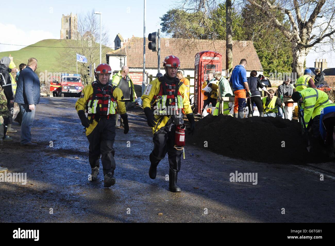 Members of Devon and Somerset Fire and Rescue service help with the flooding in Burrowbridge, Somerset. Stock Photo