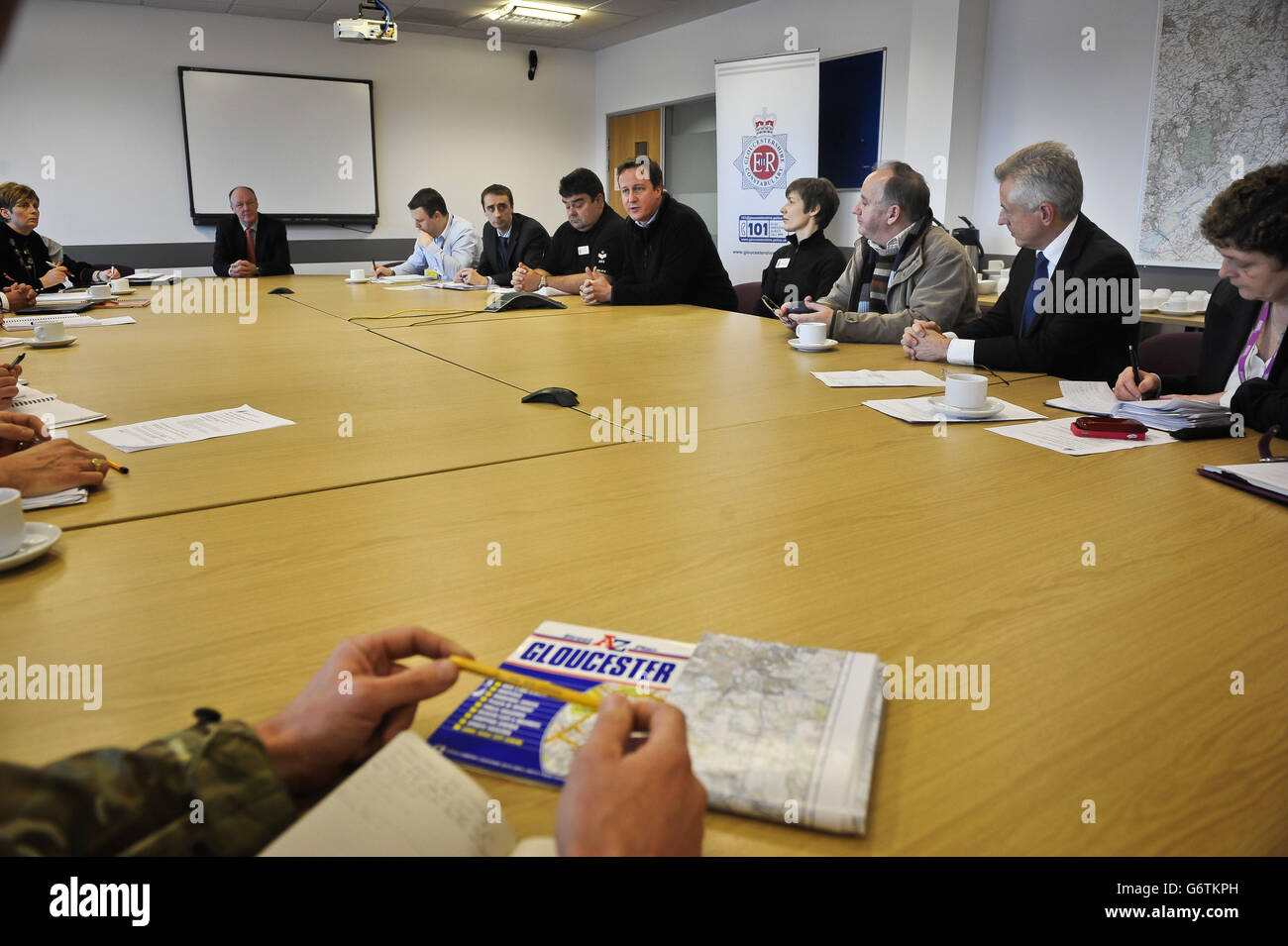 Prime Minister David Cameron (5th right) meets multi agency representatives at Silver Command in Gloucester to discuss flooding measures and work in the community. Stock Photo