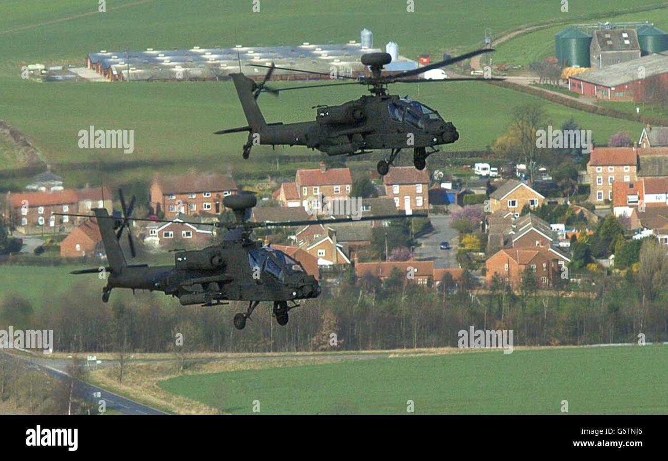 A new sight in the skies above the North Yorkshire countryside as the Apache AH Mk1 helicopters of 9 Regiment Army Air Corps fly, over villages and fields close to their base at Dishforth Airfield near Thirsk. The Army has bought 67 Apaches, which are a UK version of the American attack helicopter which has become a household name through its involvement in a string of recent conflicts; they are based both at Dishforth and with 3 and 4 Regiments Army Air Corps at Wattisham, Suffolk. Stock Photo
