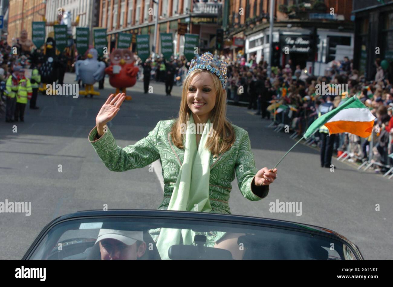 Miss Ireland and Miss World winner and Grand Marshal of the Dublin St Patrick's Day Parade Rosanna Davison, waves to the crowds, as she passes through the city. It is estimated that some 500,000 people lined the streets of Dublin for the celebrations. Stock Photo