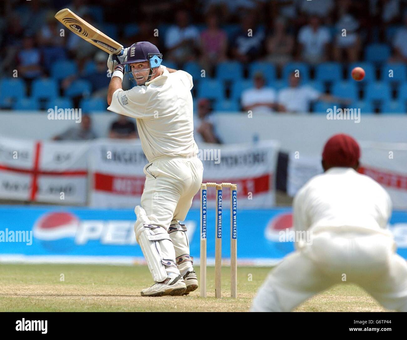 England batsman Graham Thorpe (left) edges the ball to West Indies fielder Chris Gayle off the bowling of Pedro Collin to be dismissed for 90 runs, during the fourth day of the second Test match at the Queen's Park Oval, Port of Spain, Trinidad. Stock Photo