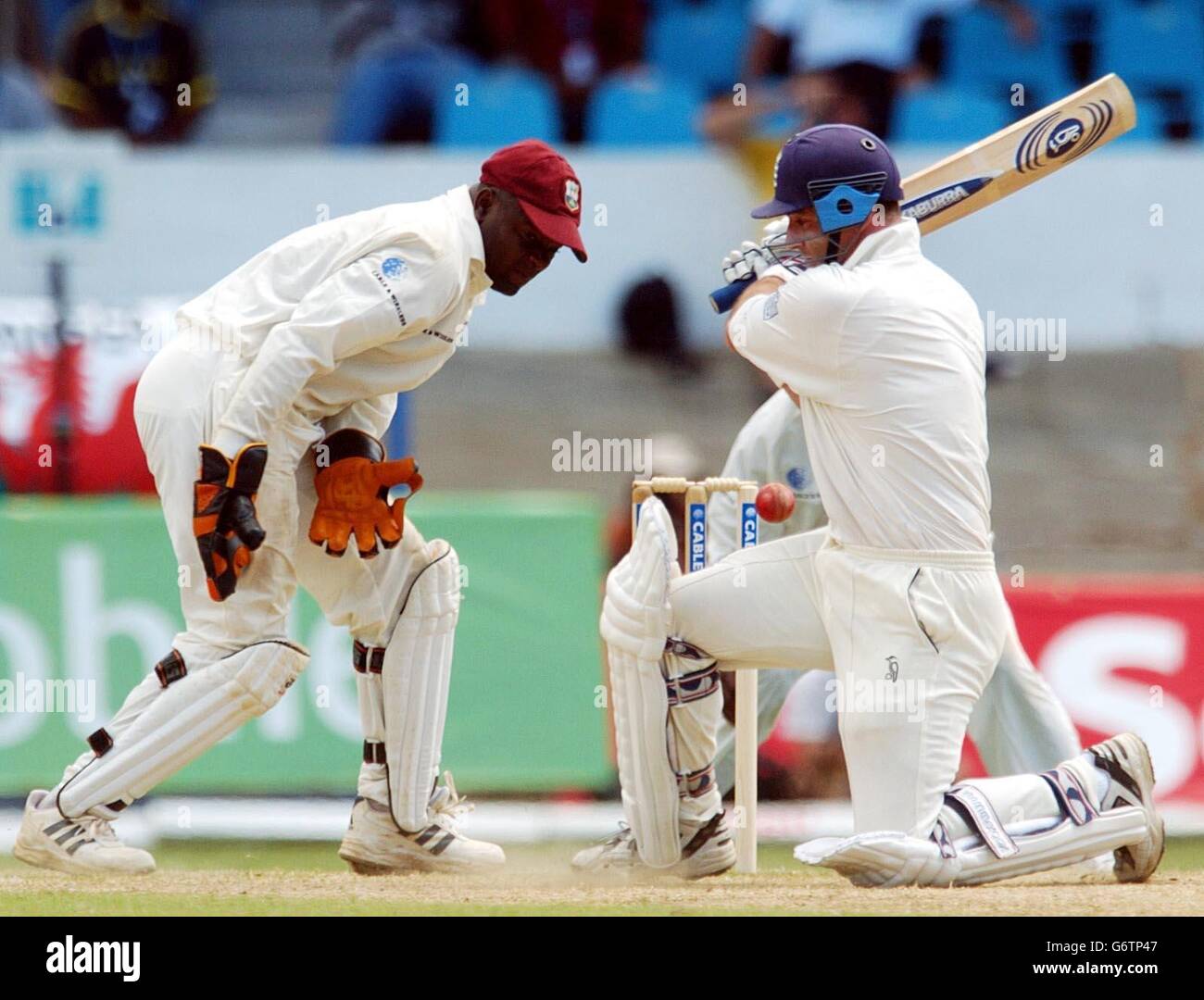 England batsman Graham Thorpe (right) attempts a sweep shot during his innings of 90 runs on the fourth day of the second Test match at the Queen's Park Oval, Port of Spain, Trinidad. Stock Photo