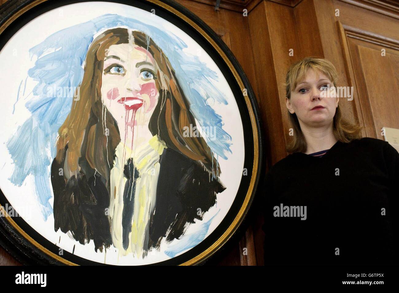 Artist Stella Vine next to her work, entitled 'Rachel' - based on the student Rachel Whitear, who died of a presumed heroin overdose - on display as part of the 'New Blood' exhibition at The Saatchi Gallery on the South Bank, central London. Stock Photo