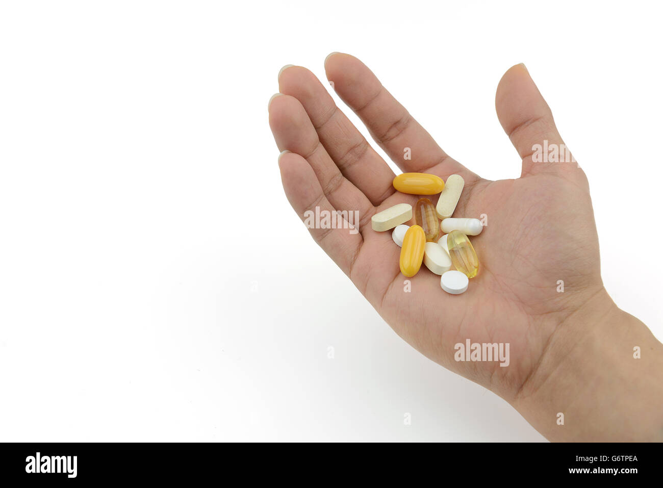 Bear hand of patient preparing medicine and vitamin to take Stock Photo