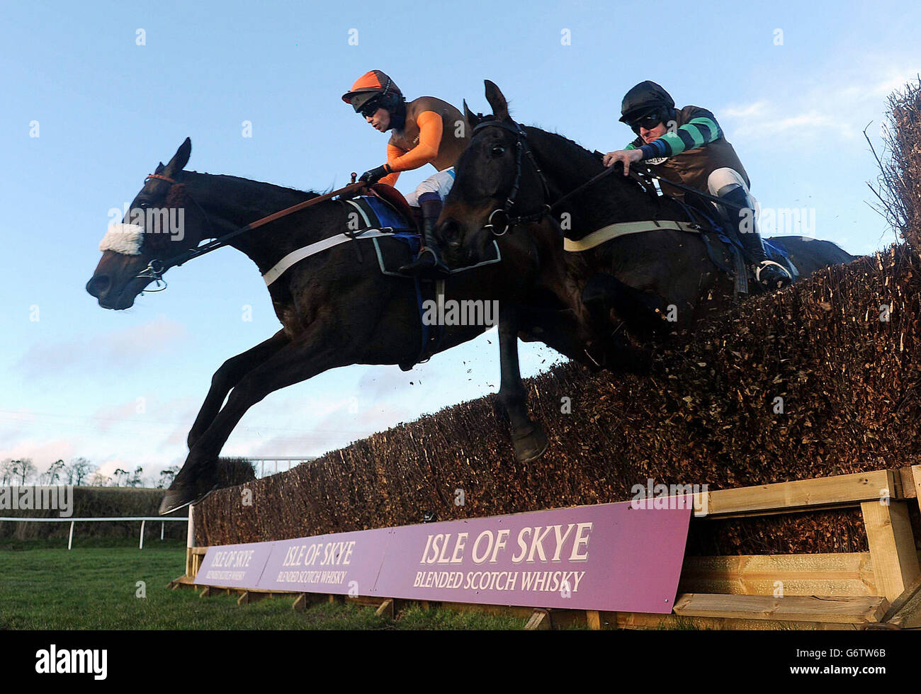 Long Run ridden by Sam Waley-Cohen (rear) goes on to win the Ivan Straker Memorial Chase ahead of Knockara Beau ridden Jan Faltejsek (right) during the Morebattle Hurdle Day at Kelso Racecourse, Wooler. Stock Photo