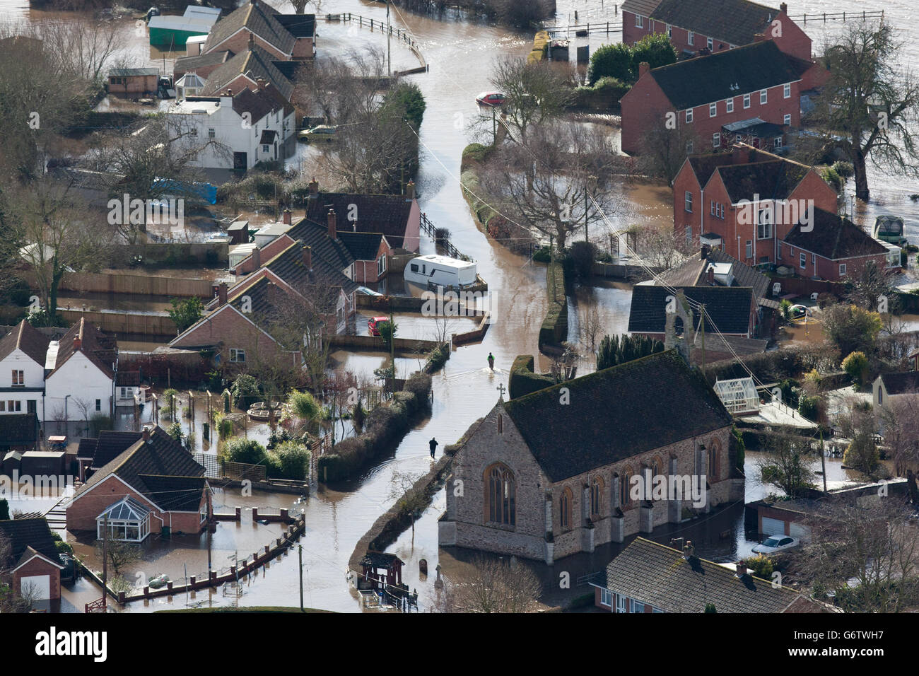 Water surrounds flooded properties in the village of Moorland on the