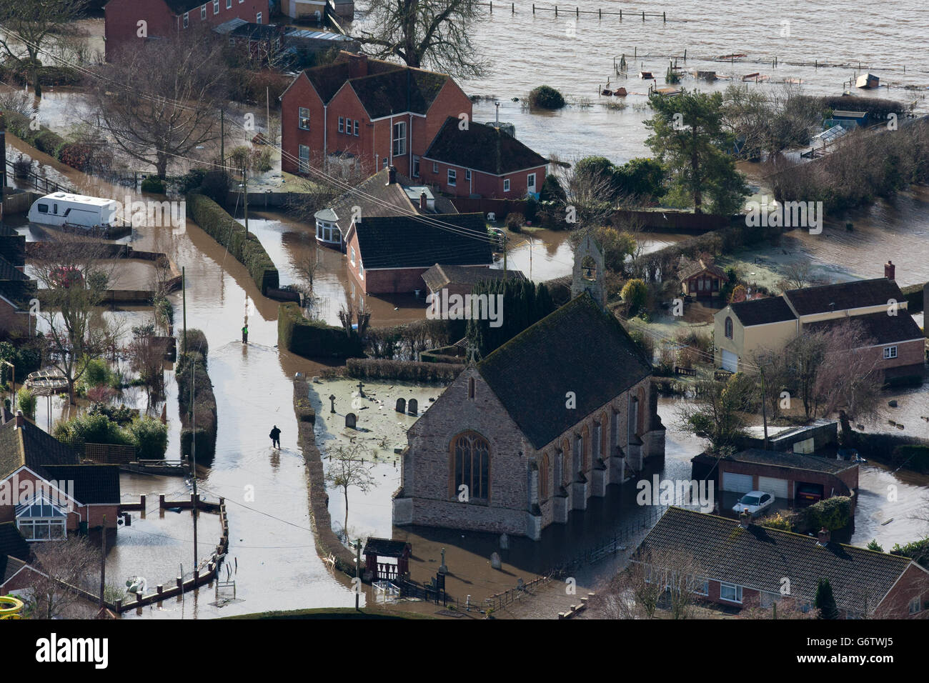 Water surrounds flooded properties in the village of Moorland on the