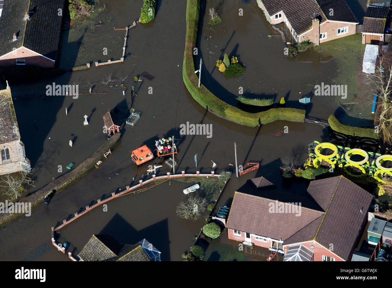 Water surrounds flooded properties in the Village of Moorland on the