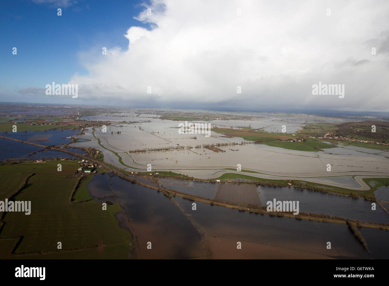Water surrounds flooded properties in the village of Moorland on the