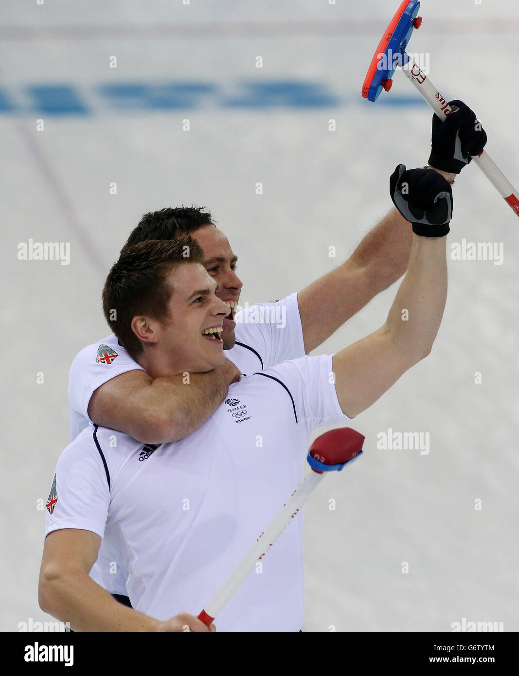 Great Britain's skip David Murdoch and Scott Andrews celebrate winning the Men's Semi Final against Sweden at the Ice Cube Curling Centre during the 2014 Sochi Olympic Games in Sochi, Russia. Stock Photo
