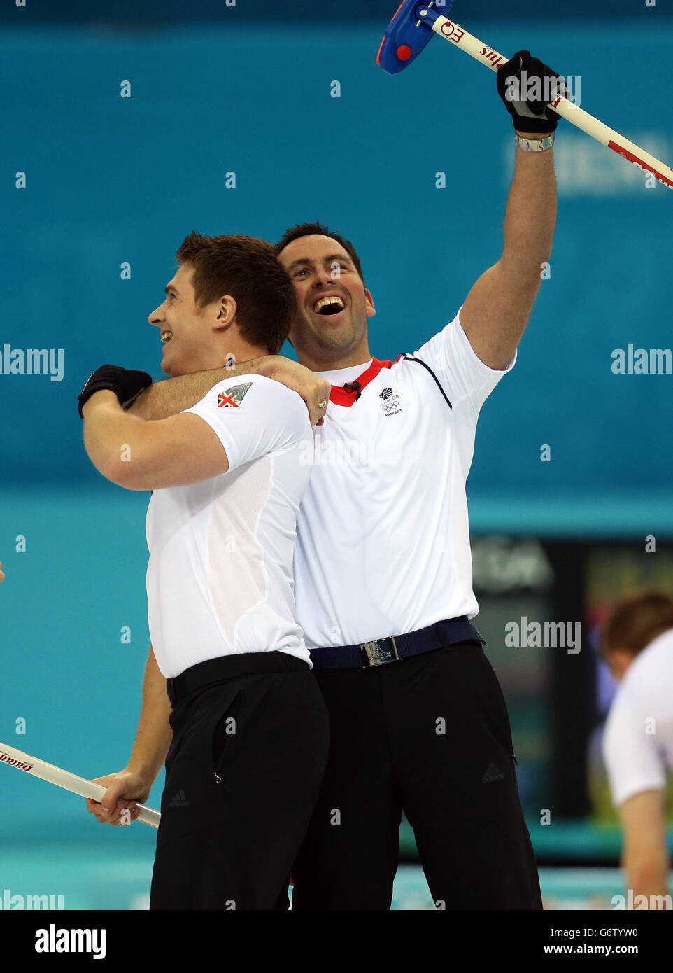 Great Britain's skip David Murdoch (right) and Scott Andrews celebrate at the end of the Men's Semi Final against Sweden at the Ice Cube Curling Centre during the 2014 Sochi Olympic Games in Sochi, Russia. Stock Photo