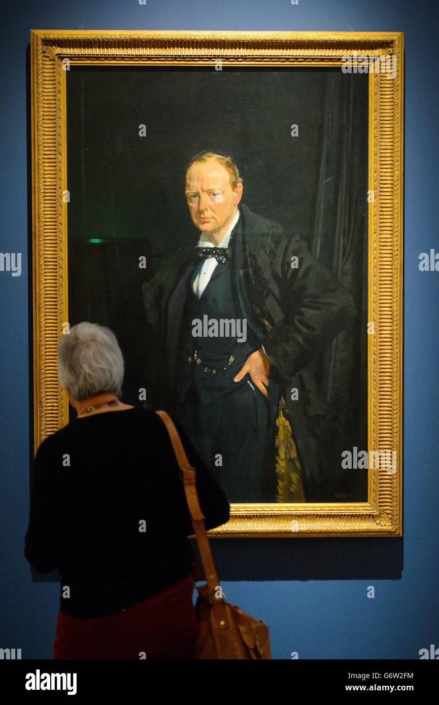 A visitor views a portrait of Winston Churchill, by William Orpen, 1916, which is part of 'The Great War in Portraits' exhibition, which runs at the National Portrait Gallery, in central London, from February 27 to June 15, 2014. Stock Photo