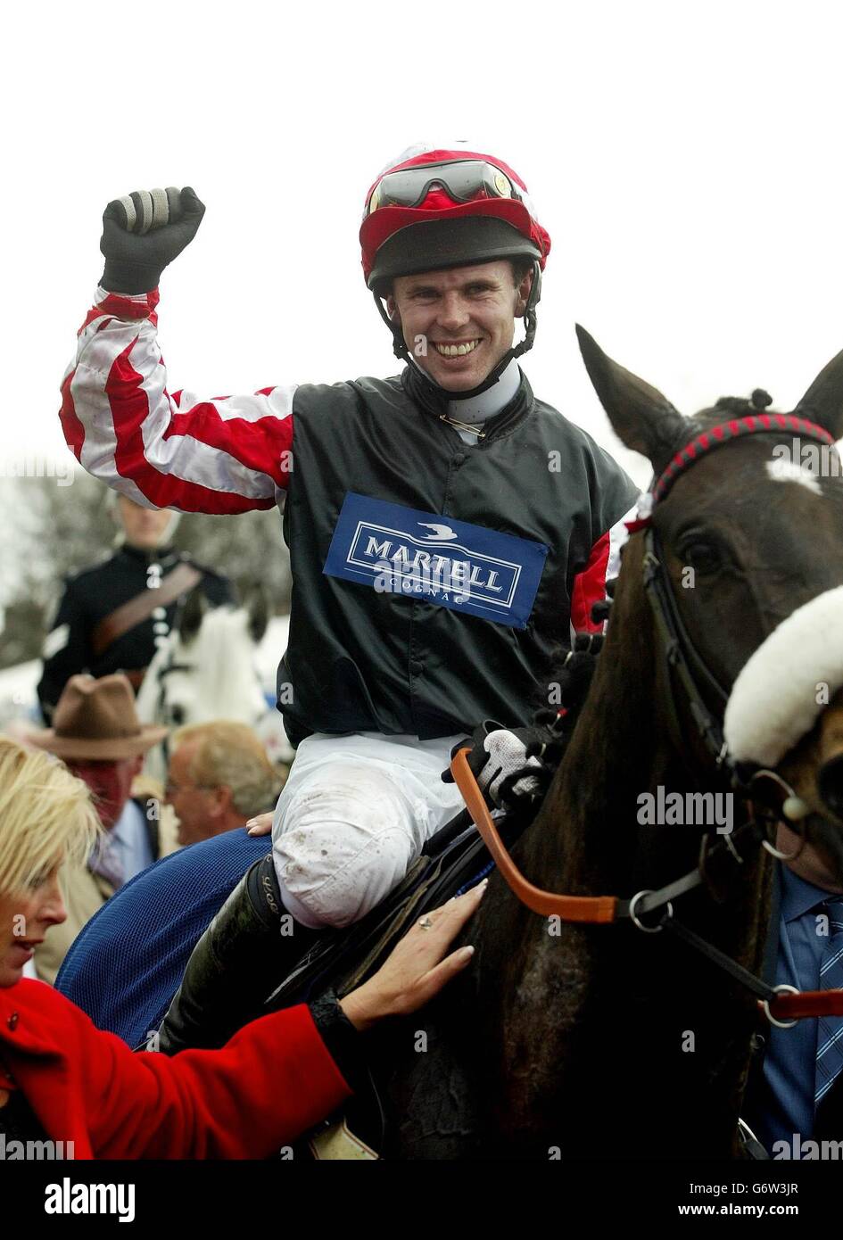 Graham Lee celebrates his victory on Amberleigh House in the Martell Cognac Grand National at Aintree. Stock Photo