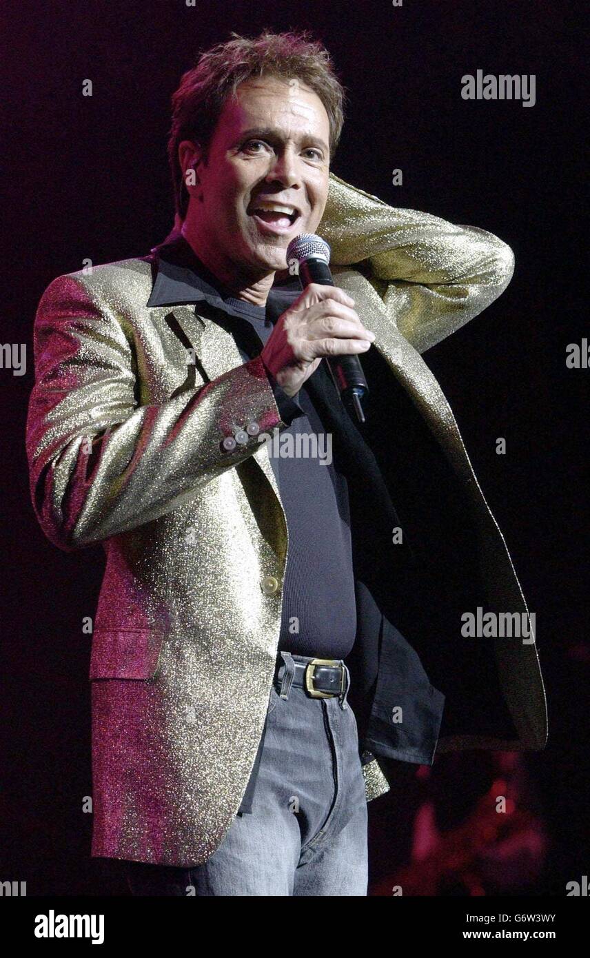 NO MERCHANDISING: Singer Sir Cliff Richard performs onstage, during his opening show at the Royal Albert Hall in London. Stock Photo