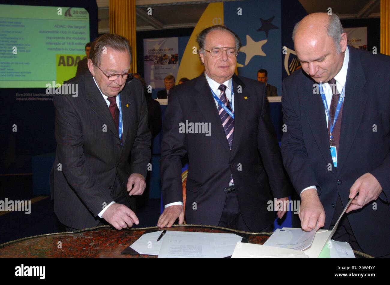 Dr Erhard Oehm (L) from ADAC with colleague, Mr Boem, signing an historic European Charter on Road Safety, at Dublin Castle, Ireland. The Charter is a key element of the European Road Saftey Action Programme that has as its goal reducing the number of road deaths in Europe by at least 50% by 2010. According to the Irish Department of Transport, 40,000 people die as a result of traffic accidents in the 15 EU countries, with 1.2 million worldwide killed each year on the roads, or over 3,000 every day. Stock Photo