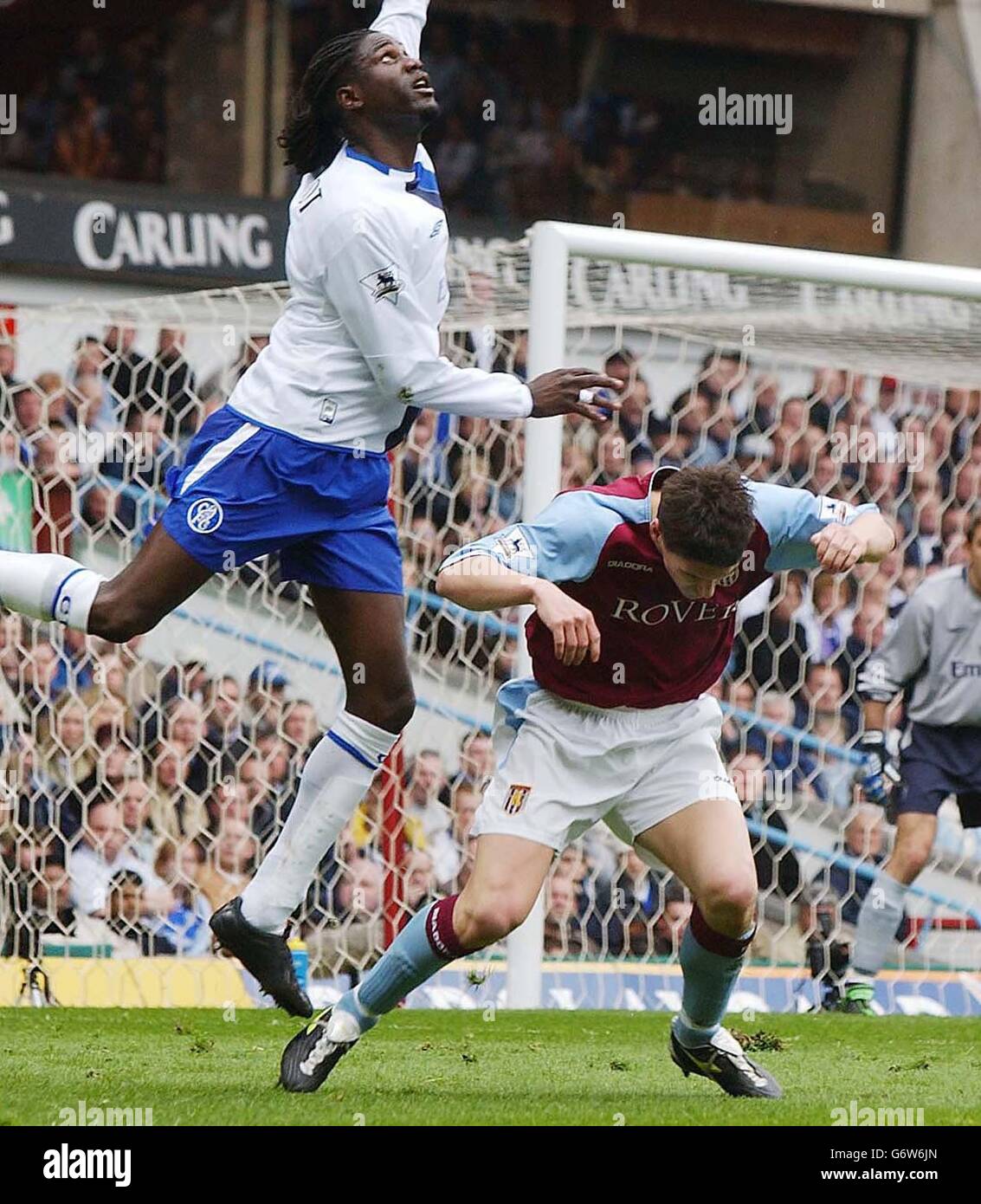 Chelsea's Mario Melchiot (L) gives away a penalty with this foul on