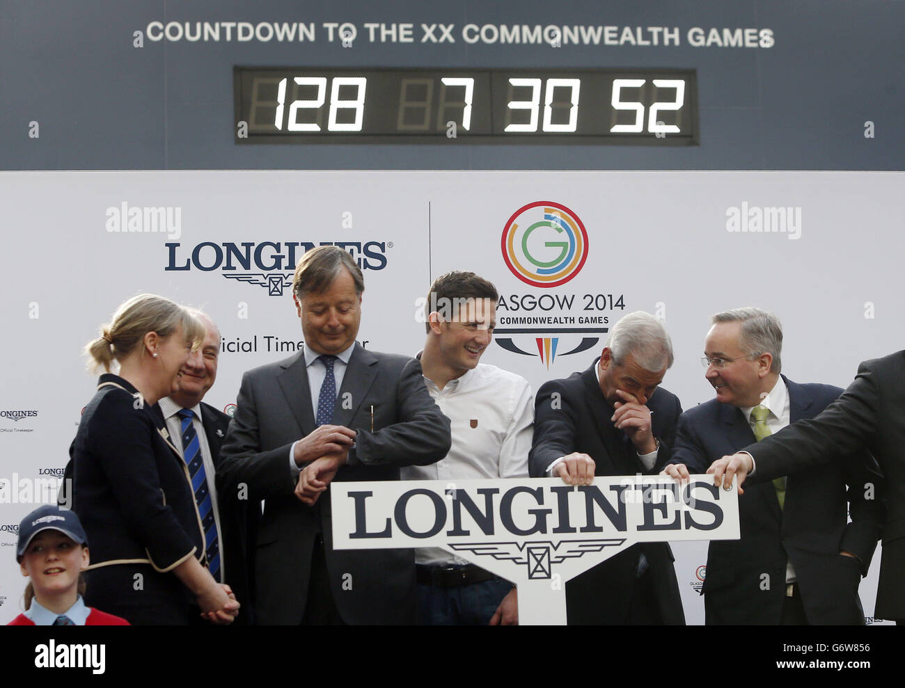 The wrong time is shown on the Official Glasgow 2014 Countdown Clock in Glasgow Central Station, Scotland, as it is switched on by (left to right) Minister for Sport Shona Robison, Chair of Commonwealth Games Scotland Michael Cavanagh, Longines Vice President Charles Villoz, Glasgow 2014 Ambassador Michael Jamieson, Glasgow 2014 Chairman Lord Smith of Kelvin and Leader of Glasgow City Council Gordon Matheson. Stock Photo