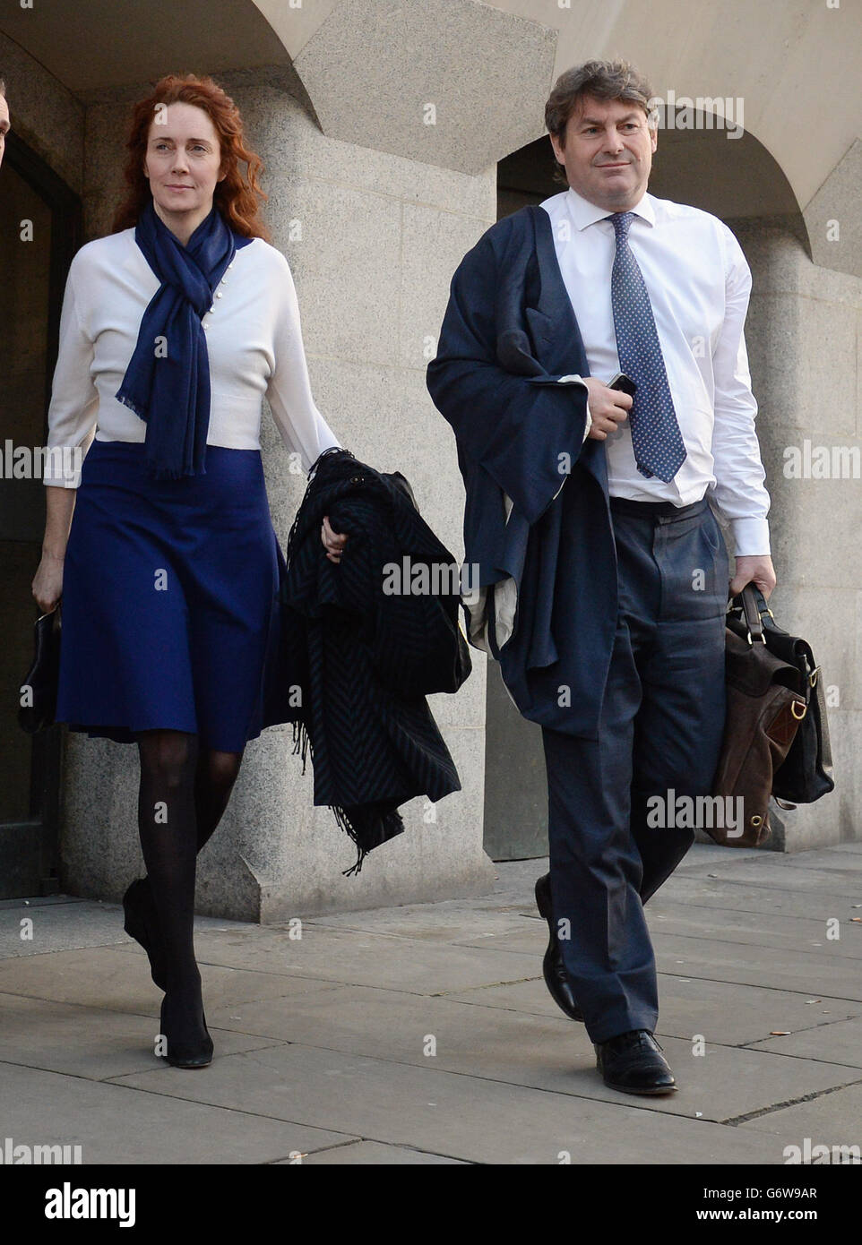 Former News International chief executive Rebekah Brooks and her husband Charlie Brooks leave the Old Bailey as the phone hacking trial continues. Stock Photo