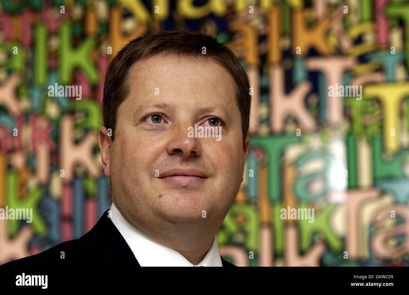 Talktalk Owner Charles Dunstone, CEO of Carphone Warehouse, poses for photographers ...