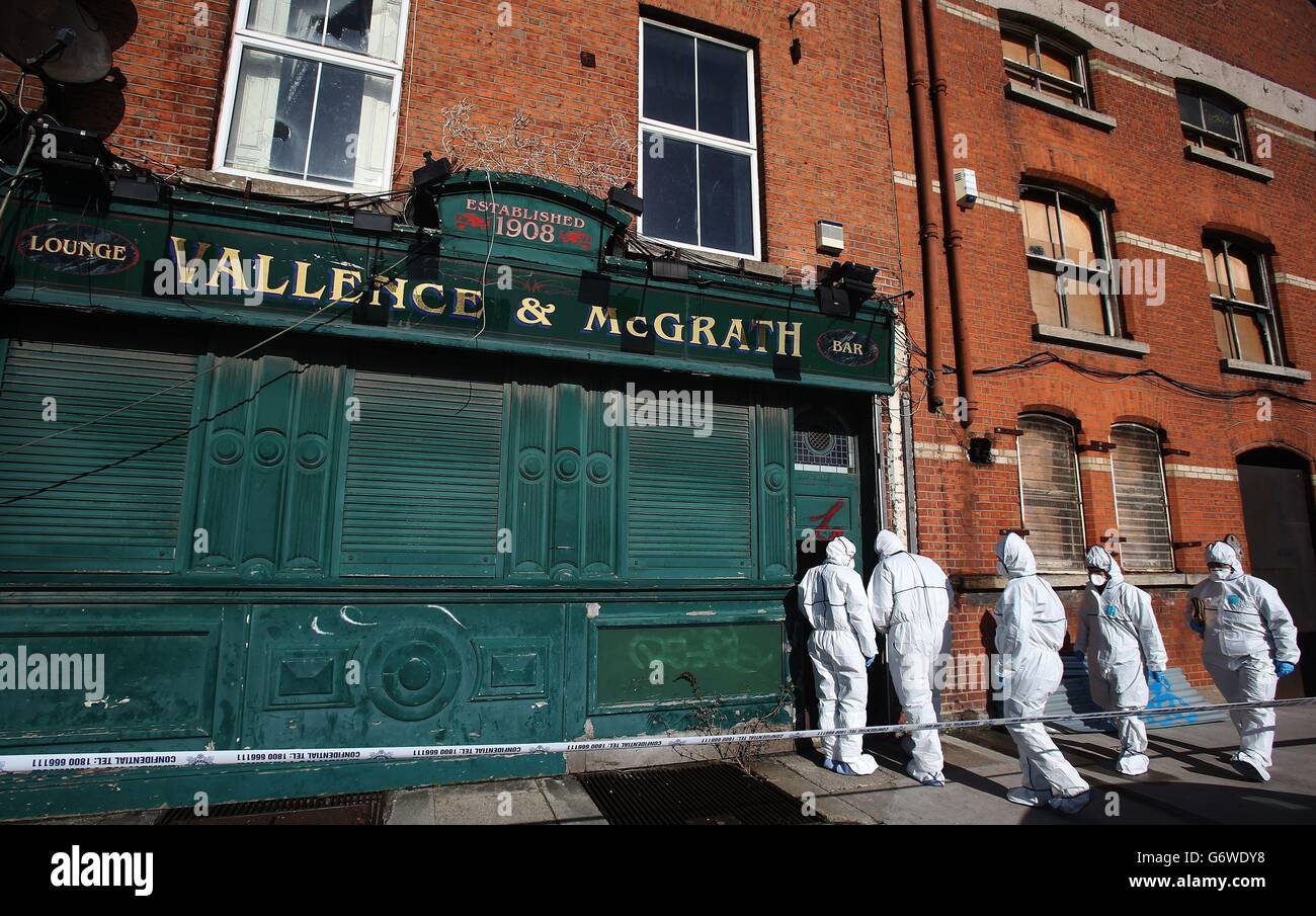 Garda forensics at a disused premises on North Wall Quay in Dublin where the body of a man in his early 40's was found shortly after 10.45pm yesterday. Stock Photo