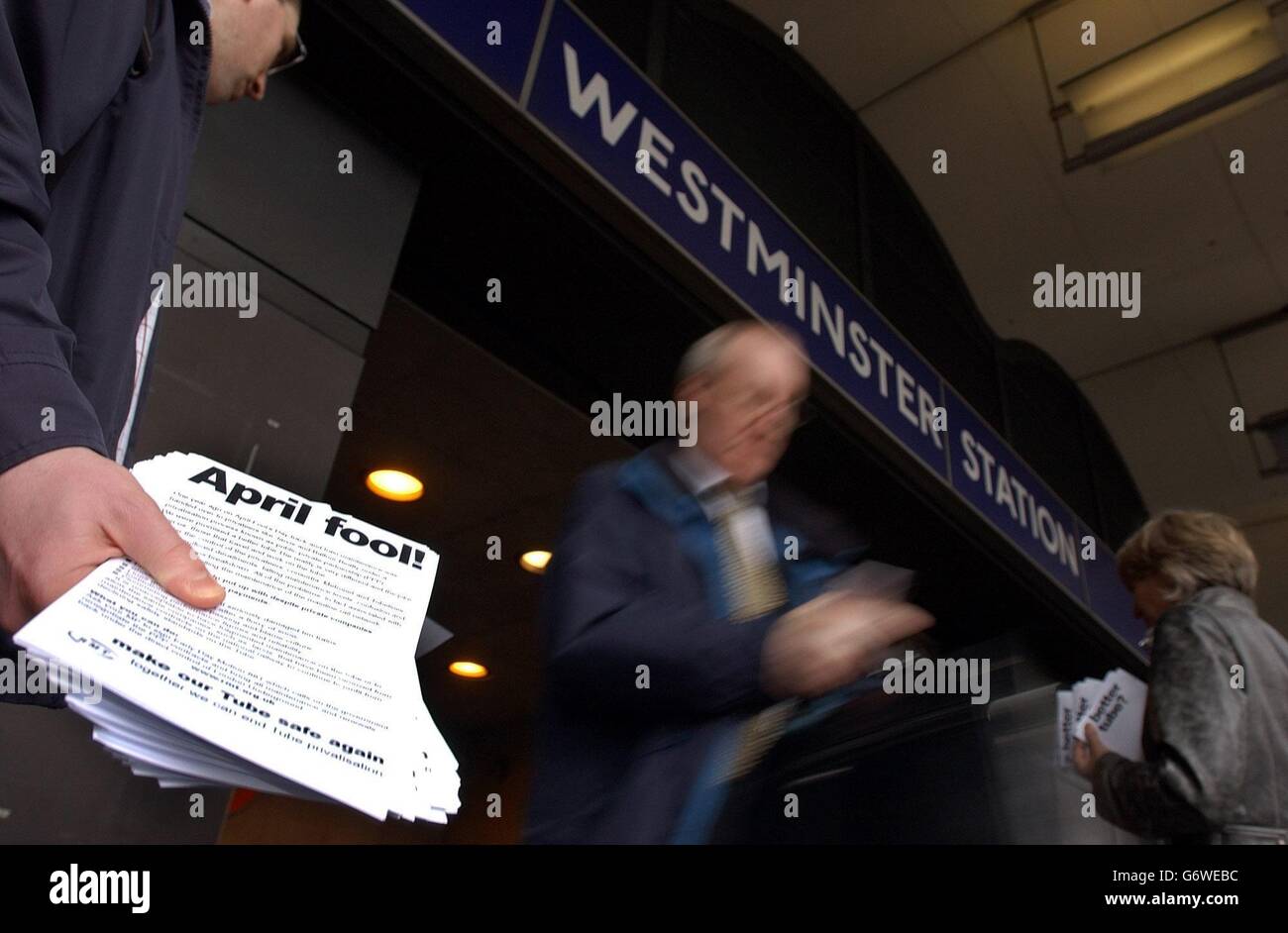 Members of the Rail Maritime and Transport union hand out leaflets to commuters outside Westminster underground station in London. Bob Crow, general secretary of the Rail Maritime and Transport union and London organiser Bobby Law were handing out leaflets in Westminster calling on commuters to back the campaign to bring all maintenance and track renewals under the direct control of London Underground. Stock Photo