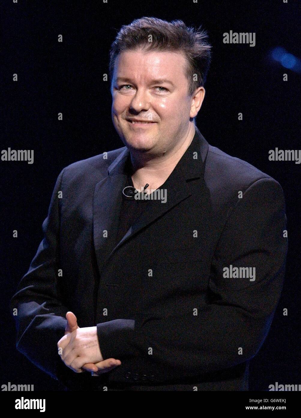 Celebrity on stage performing comedian ricky gervais hi-res stock