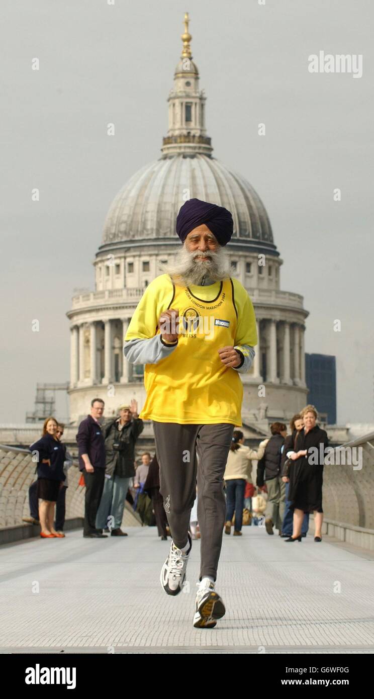 This year's oldest London Marathon runner, Fauja Singh, celebrates his 93rd  birthday as he runs across the Millennium Bridge in London. This will be  the fifth time the age-defying athlete, originally from