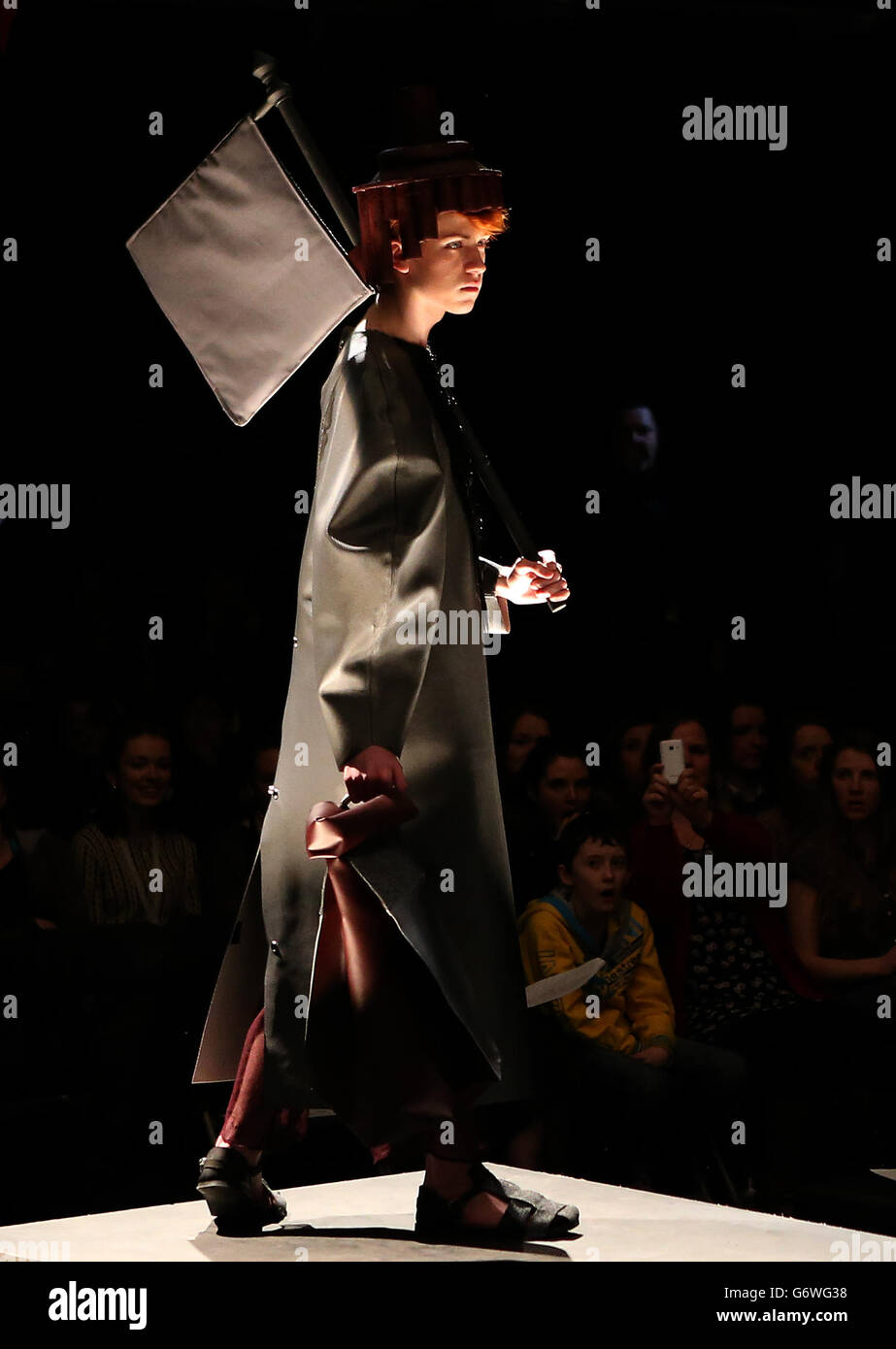 A model showcases Textile Design students work during the Glasgow School of Art Fashion Show 2014, Glasgow. Stock Photo