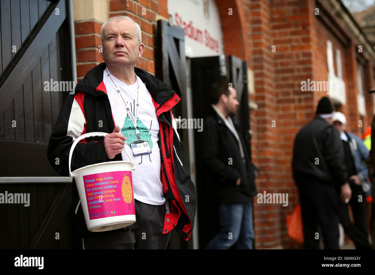 Shooting Star CHASE volunteers outside the Stadium Store collecting