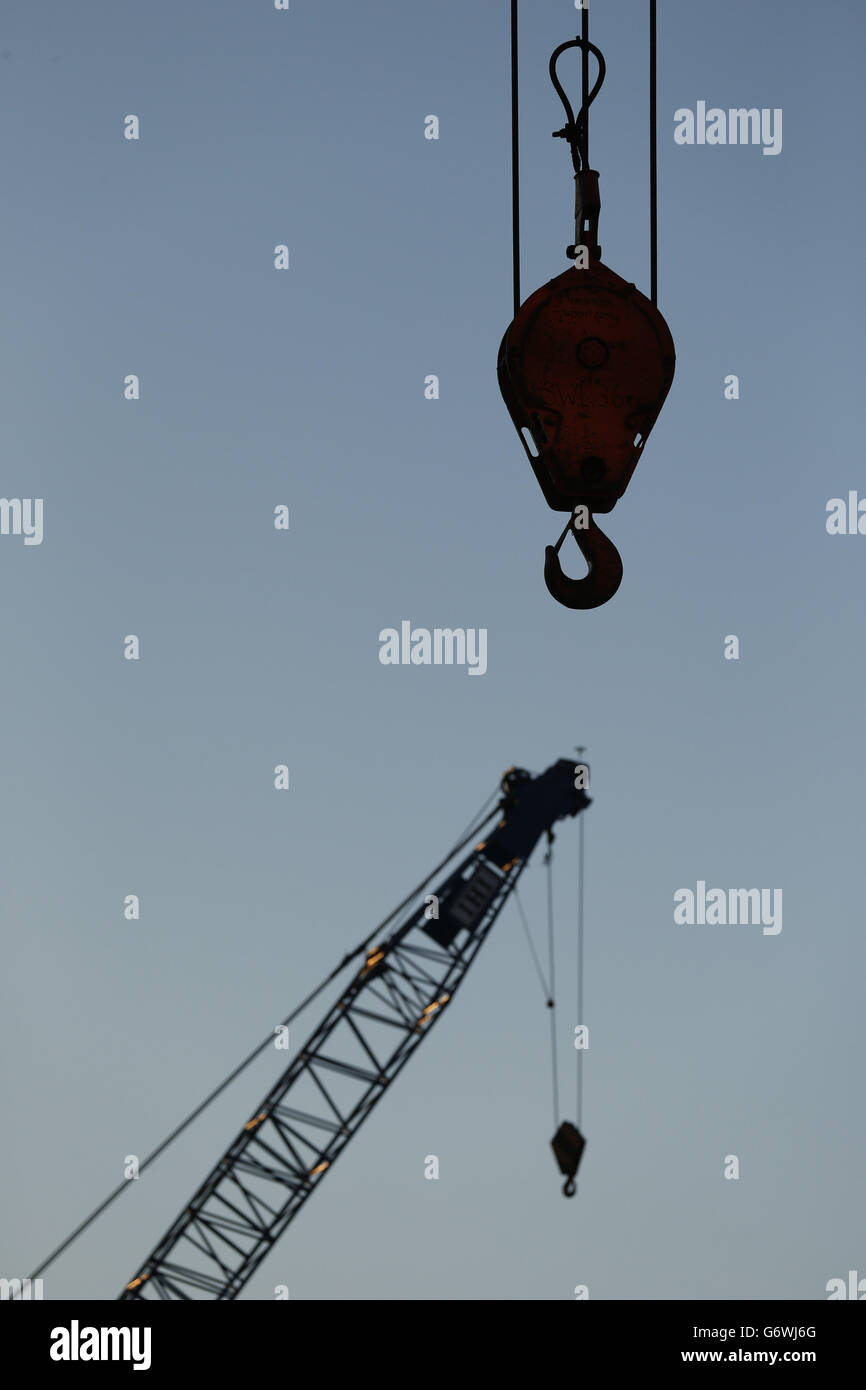 A late afternoon view of cranes on a construction site adjacent to London Victoria station. Stock Photo