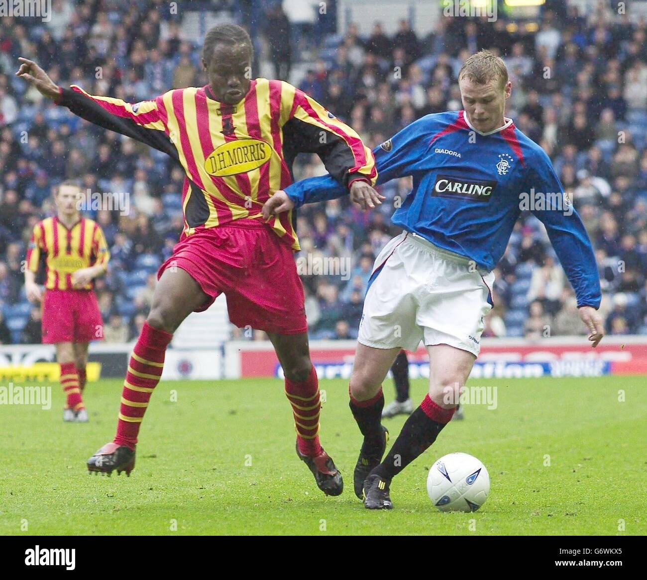 Rangers' Michael Ball (right) in action against Partick Thistle's Jean Yves Anis during their Bank of Scotland Premier League match Ibrox Park, Glasgow, Saturday 17th April 2004. EDITORIAL USE ONLY. Stock Photo