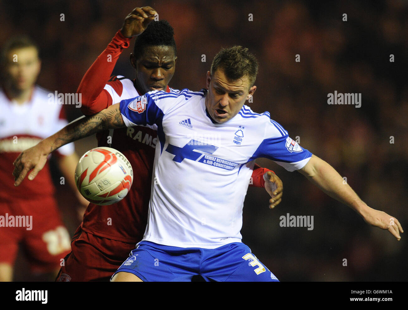 Middlesbrough's Kenneth Omeruo and Nottingham Forest's Simon Cox battle for the ball during the Sky Bet Championship match at the Riverside Stadium, Middlesbrough. Stock Photo