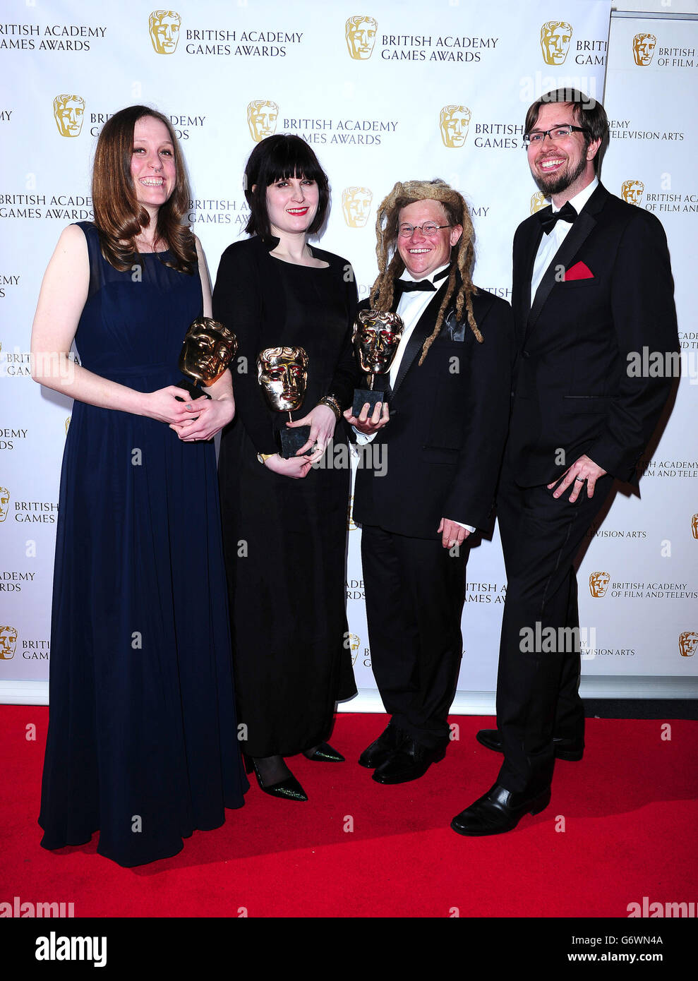 The Development Team of the Fullbright Company with the Debut Game award, for Gone Home at the British Academy Games Awards at Tobacco Dock, London. Stock Photo