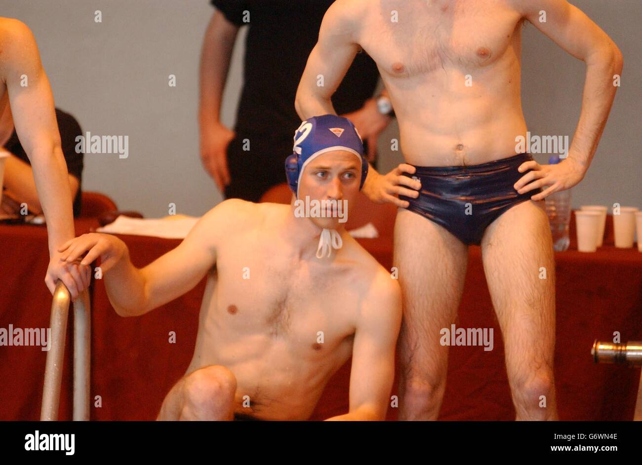 Prince William takes a break while making his water polo debut for the Scot...