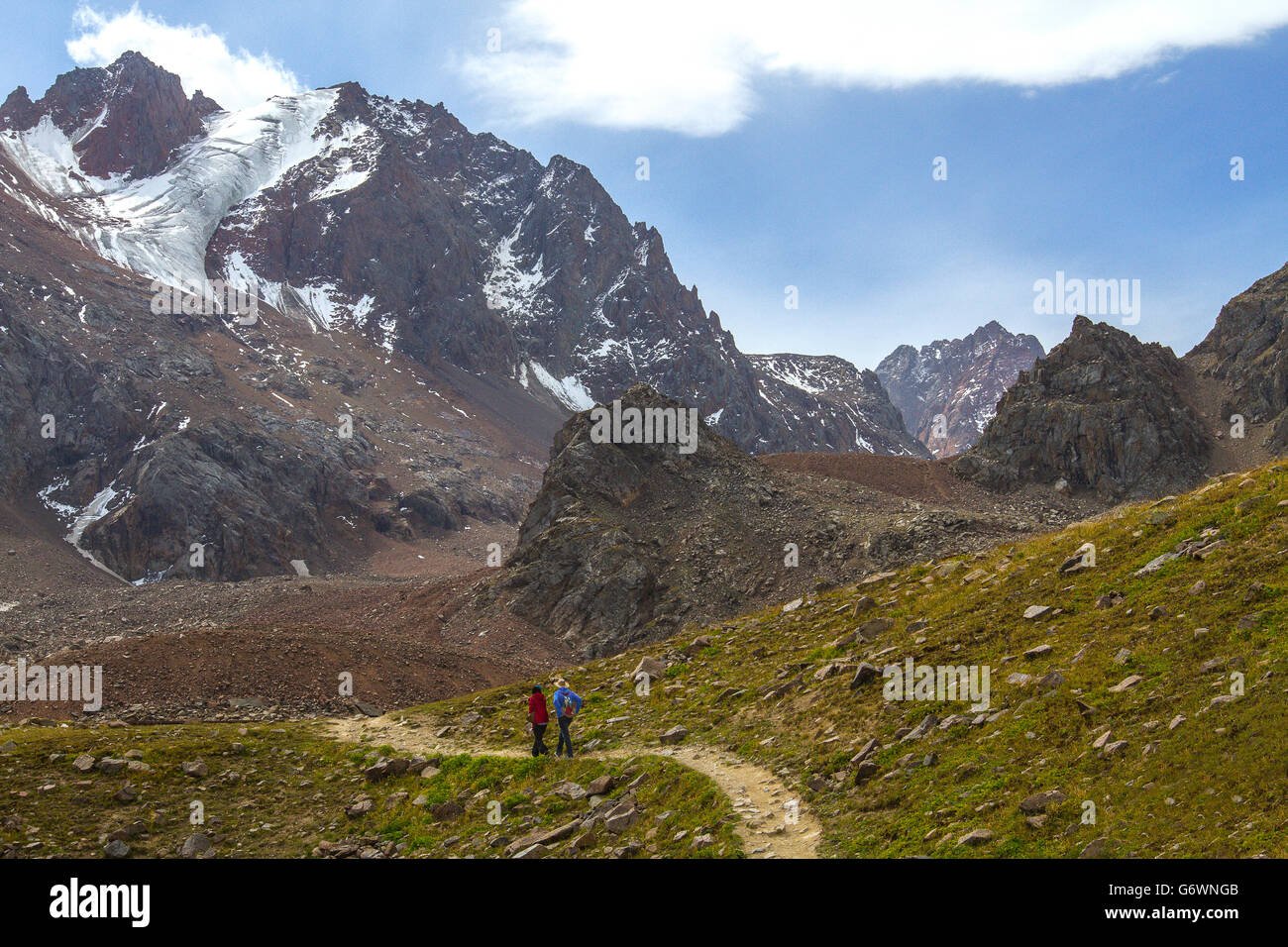 Couple hiking in the Ala Tau Mountains in Almaty, Kazakhstan. Stock Photo