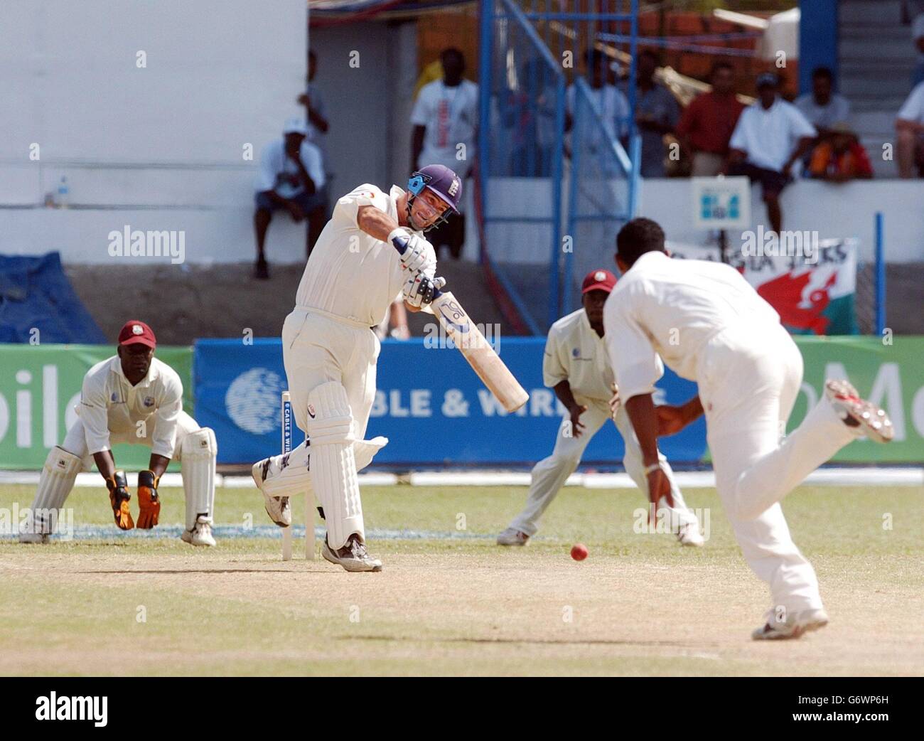 England batsman Graham Thorpe (centre) drives the ball for four runs during the fifth day of the second Test against the West Indies at the Queen's Park Oval, Port of Spain, Trinidad. England won by 7 wickets. Stock Photo