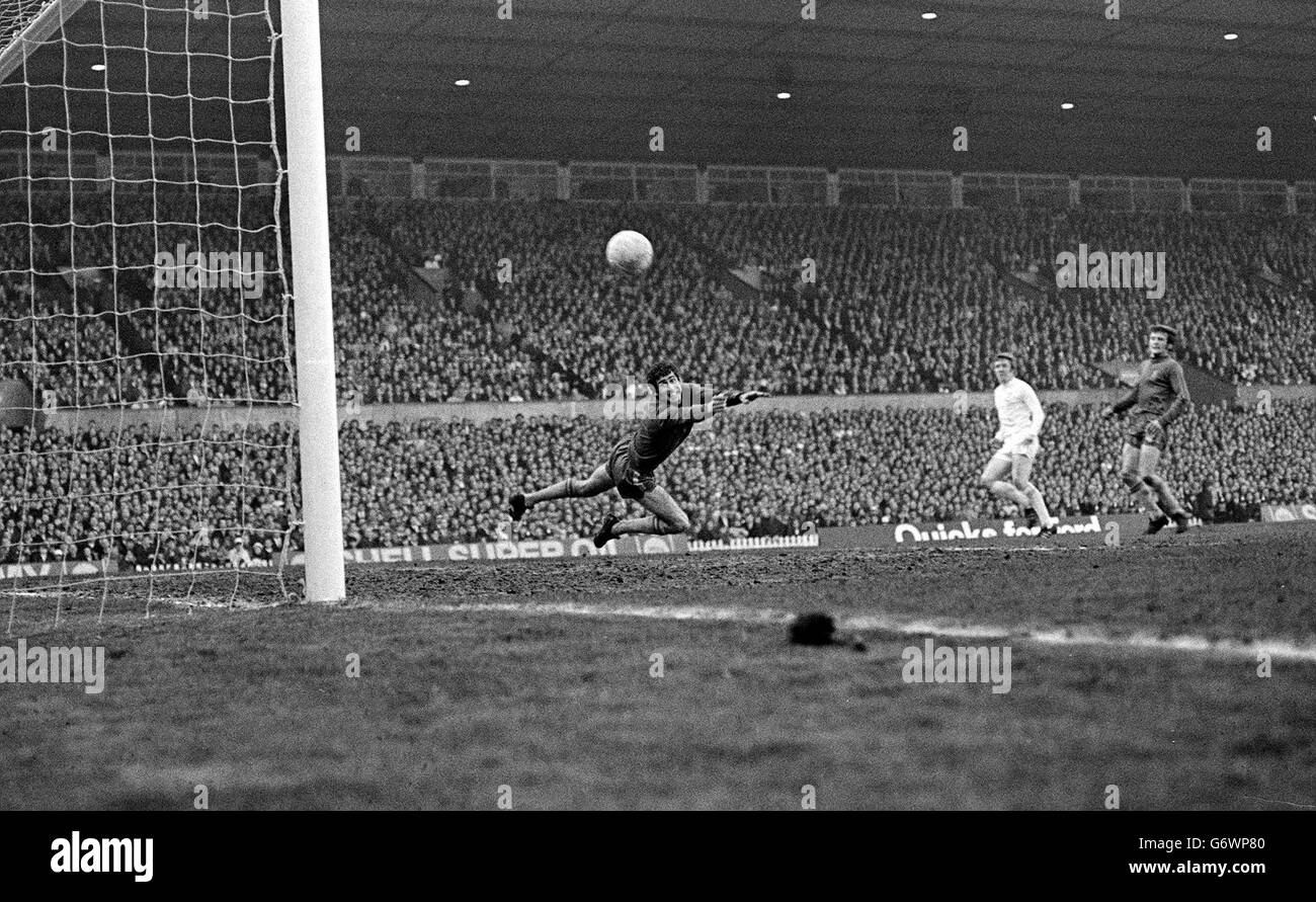 Chelsea's Peter Bonetti, who was injured in the game, dives across his goal but is beaten by the shot from Leeds centre forward Mick Jones, who scored the first goal for the Yorkshiremen in the FA Cup Final replay at Old Trafford, Manchester. Stock Photo