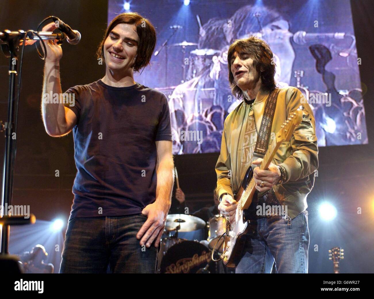 Singer Kelly Jones (left) from Stereophonics and Ronnie Wood perform live on stage during 'The Who And Friends' fundraising week of gigs, in aid of the Teenage Cancer Trust, at the Royal Albert Hall in London. Stock Photo