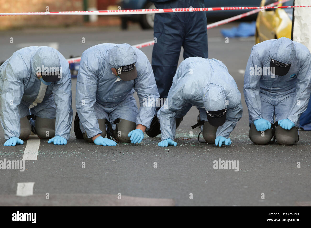 Police forensic officers at the site of a double murder investigation ...